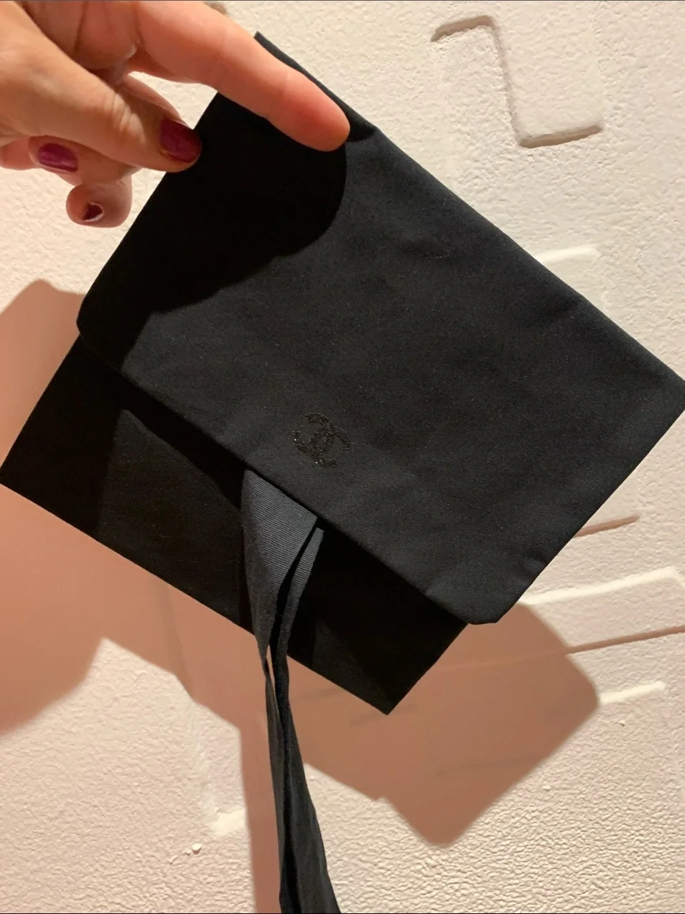 Authentic  black Chanel rare pouch with CC sparky logo with closing strops.Must!